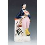 A Staffordshire figure of Robert Burns, circa 1850, modelled standing, leaning against a plinth with