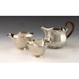 A Victorian Aesthetic Movement silver tea set, Hukin and Heath, London 1883