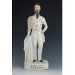 A Staffordshire pottery figure of Victor Emmanuel II, 'King of Sardinia', circa 1860, modelled stand