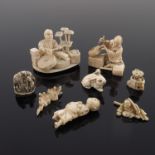 λ A group of Japanese ivory okimonos, netsuke and related components, Meiji period, 1869-1912 and