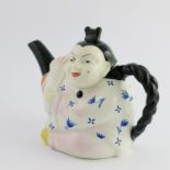 A Minton majolica Chinaman teapot and cover, modelled as a seated oriental with his plait forming