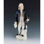 A Staffordshire figure of George Washington, circa 1855, modelled standing, holding a hat and a scro