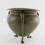 William Soutter & Sons, an Arts & Crafts brass planter, of teardrop form with tendril tripod legs