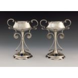 A pair of Arts and Crafts silver pedestal vases, Mappin and Webb, Sheffield 1907