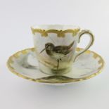 A Worcester Royal China Works painted cabinet cup and saucer