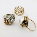 A 9ct gold and white metal wrythen textured open work ring