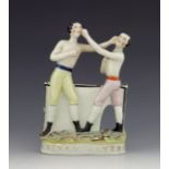 A Staffordshire figure of Heenan and Sayer, circa 1860, modelled bare-chested, wearing coloured shor