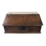 A George III English oak table top cleric's box, the sloping front engraved with a tulip,