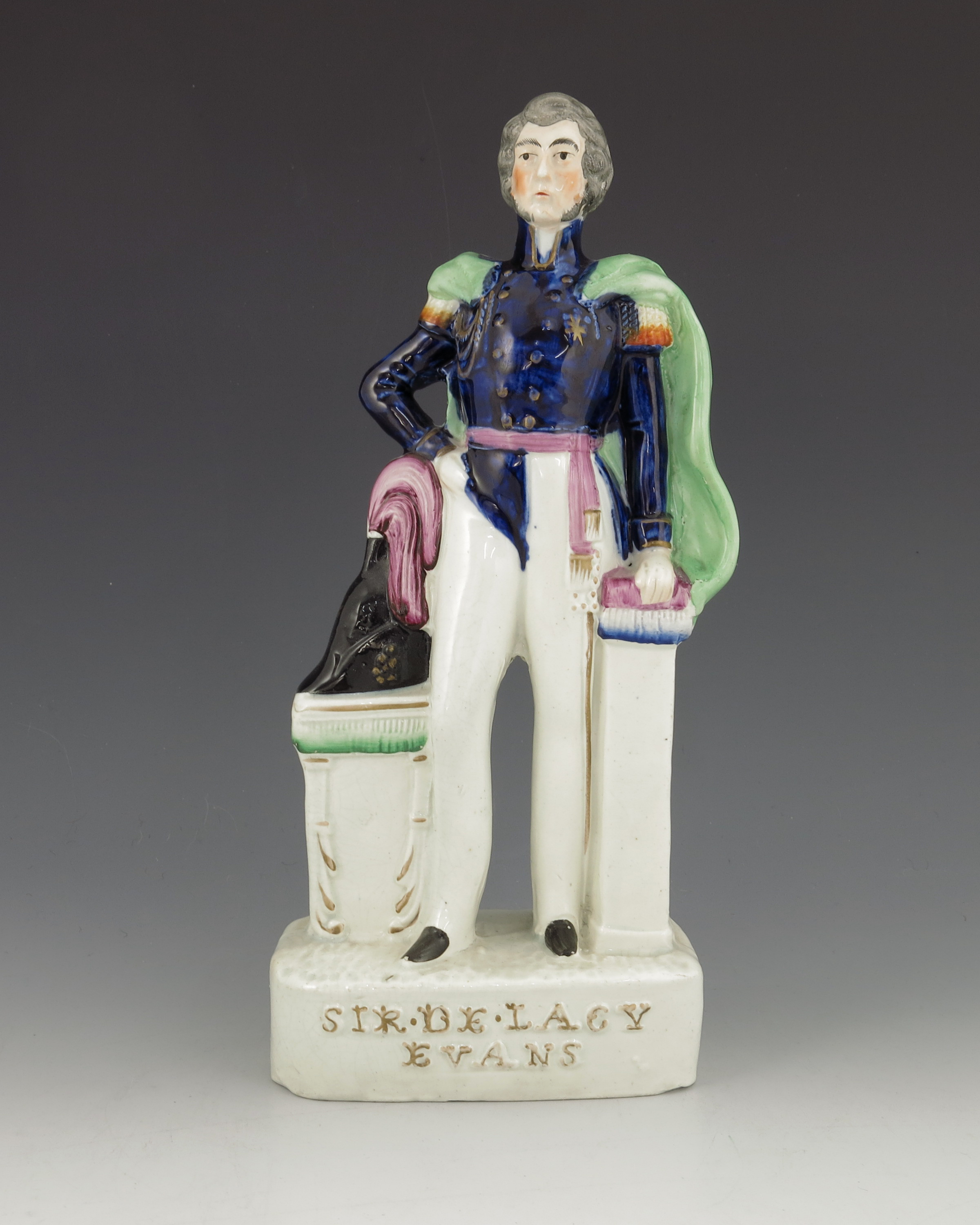 A Staffordshire figure of 'Sir De Lacy Evans', circa 1854, modelled standing beside a cocked hat on