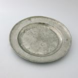 An 18th Century pewter single reeded charger with ownership initials 'A.B' to the front rim, circa
