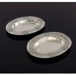 Bernard Cuzner for Liberty and Co., a pair of Arts and Crafts silver dishes, Birmingham 1919