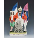 A Staffordshire figure group titled 'The Victory', circa 1856, modelled as an English sailor sitting