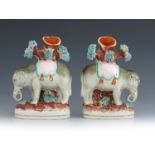 A pair of Staffordshire flat back spill vases, circa 1860, modelled as elephants standing in front