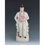 A Staffordshire figure of Arthur Orton, titled 'Sir R Tichborne', circa 1874, modelled standing with