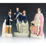 A Staffordshire figure of Prince Albert, circa 1850, modelled standing beside a plinth, holding a pl