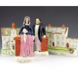 A pair of Staffordshire figures of the murderer 'James B Rush' and his accomplice 'Emily Sandford',