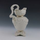 A Belleek second period ewer, circa 1880, relief moulded rococo scrolls, printed marks, 25cm high