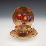 A Royal Worcester fruit painted miniature tea trio