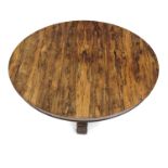 A Regency rosewood breakfast table, circa 1820, circular tilt top, pyramid support with applied
