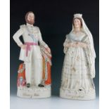 A pair of Staffordshire figures, 'Queen of England' and 'Prince of Wales', circa 1870, modelled stan