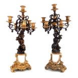 A pair of late 19th Century French ormolu mounted bronze candelabra of Rococo design, circa 1880,
