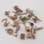 A collection of various 9 carat gold charms