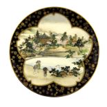 A Japanese satsuma plate, Meiji period, 1868-1912, painted with figures of leisure in a river pagoda