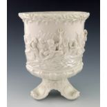 A Belleek first period wine cooler, circa 1880, footed form, relief moulded classical putti