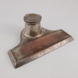 A E Jones, an Arts and Crafts silver plated copper inkstand