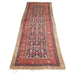 An antique Persian Sarab long rug, camel wool, numerous small animals and people, 336 by 136cm