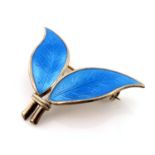 Willy Winnaess for David Andersen, a Norwegian silver gilt and enamelled two leaf brooch