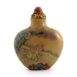 A Chinese famille rose enamelled snuff bottle, iron red Qianlong mark and of the period