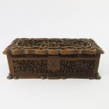 A Chinese treen export table casket, late 19th Century, serpentine cover, blind carved throughout
