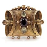 A Victorian gold metal gem set brooch