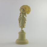 λ A European ivory figurine, late 19th Century, probably Dieppe, carved as a standing lady in 18th