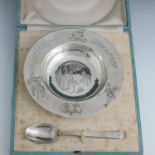 Asprey, London, a child's silver Humpty Dumpty bowl and matching spoon, bright cut engraved with the