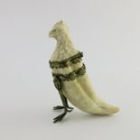 A 19th Century European ivory ink vessel, in the form of an eagle with hinged head with realistic