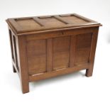 A late Victorian or Edwardian light oak carpenter's chest, panelled top and sides with chamfered