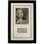 Grace Kelly (American, 1929-1982), autograph with a sepia photograph above, 35 by 19cm, framed as