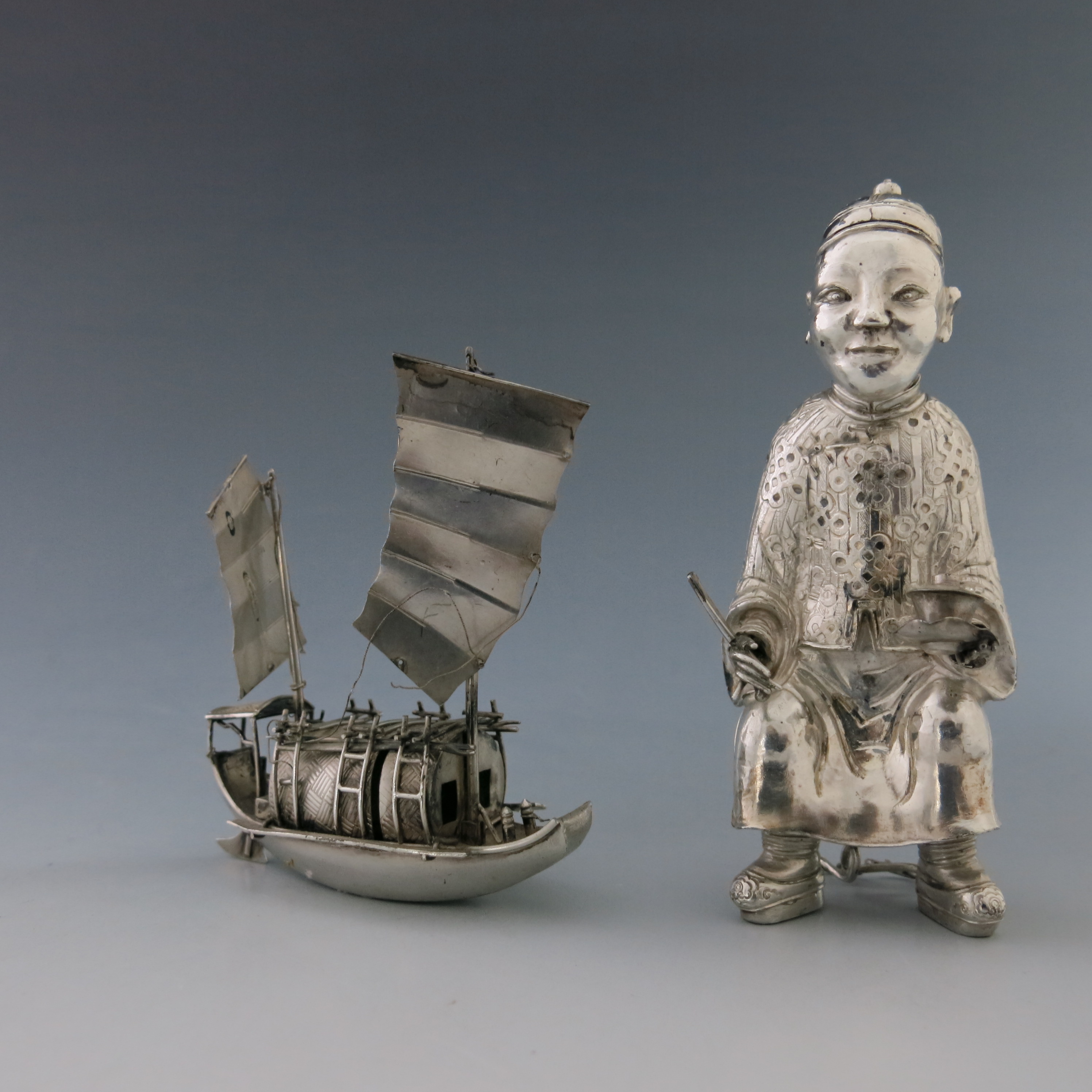A novelty Chinese white metal condiment, early 20th Century, in the form of a seated Mandarin, - Image 2 of 5