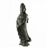A large Chinese carved softwood figure of a female deity, 20th Century, modelled standing wearing