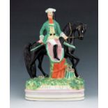 A Staffordshire figure of 'Dick Turpin', circa 1850, modelled on horseback, wearing a green coat and