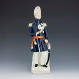 A Staffordshire Crimean War figure of Field-Marshall Lord Raglan, circa 1854, modelled standing in f