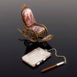 A Continental gilt miniature rocking chair, the seat back, seat and footrest with figure and