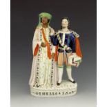 A Staffordshire theatrical figure of 'Othello & Iago', circa 1858, modelled standing beside one anot
