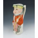 A Staffordshire toby jug, circa 1880, modelled as a monkey playing the cello, polychrome enamel pain