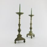 A pair of brass pricket candlesticks, North European, 18th Century, the prickets over dished drip