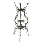 A wrought iron washstand, Italian, 17th/18th Century, of tripod form with scrollwork frame, gilt