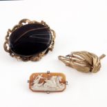 Three decorative brooches to include a 19th Century brown agate cabochon brooch