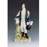 A Staffordshire figure of Robert Burns, circa 1850, modelled sanding, holding a book and a bonnet, p